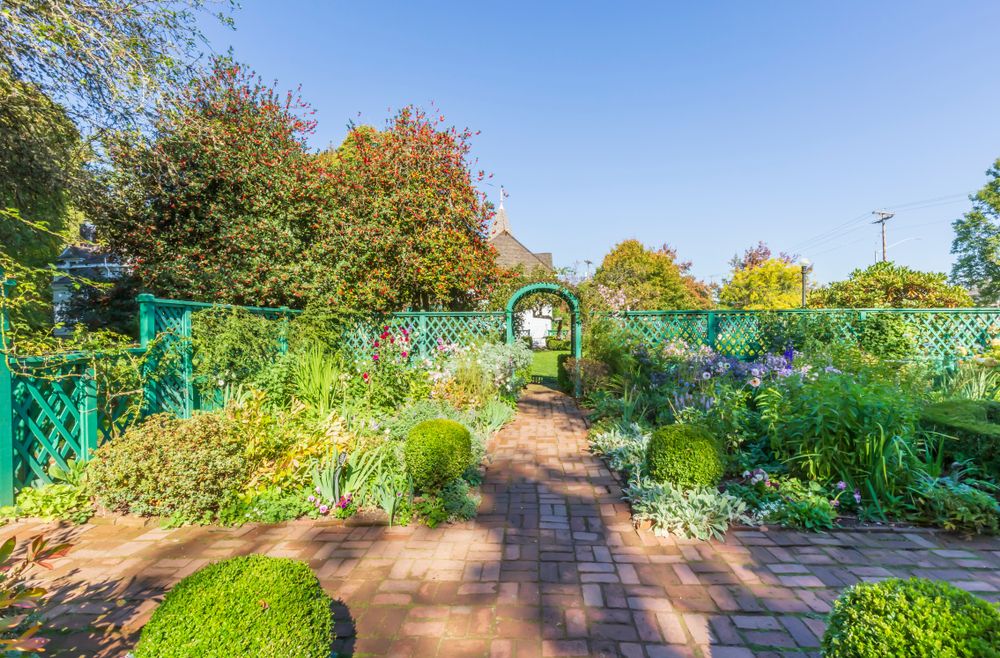 Pathway lined with flora at Deepwood Museum and Gardens