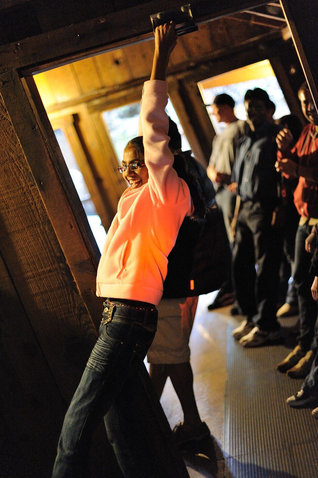 A person standing at The Mystery Spot