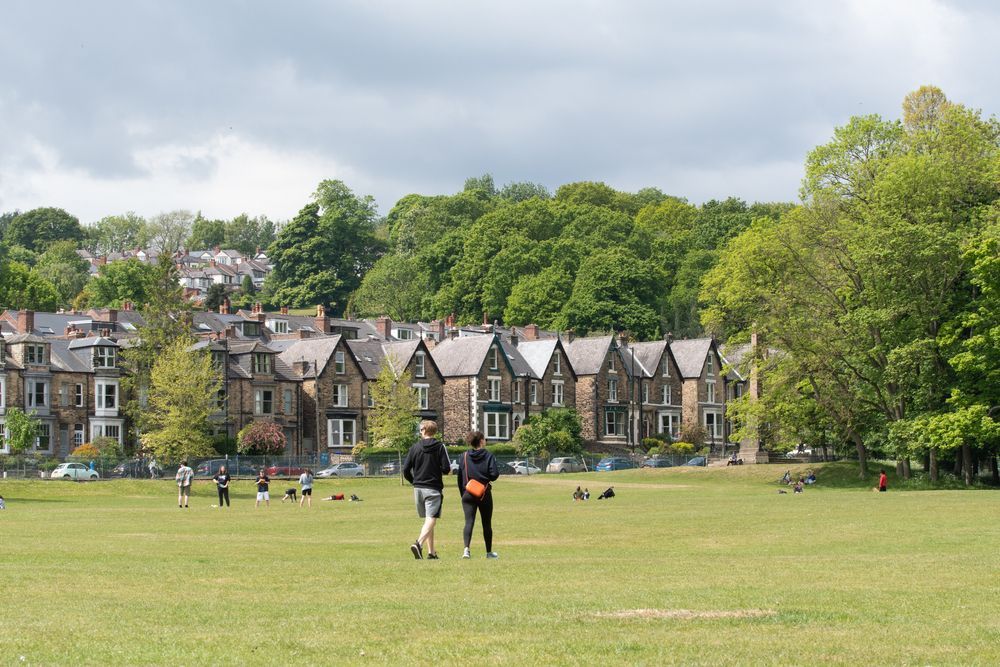 People enjoying the sun at Endcliffe Park