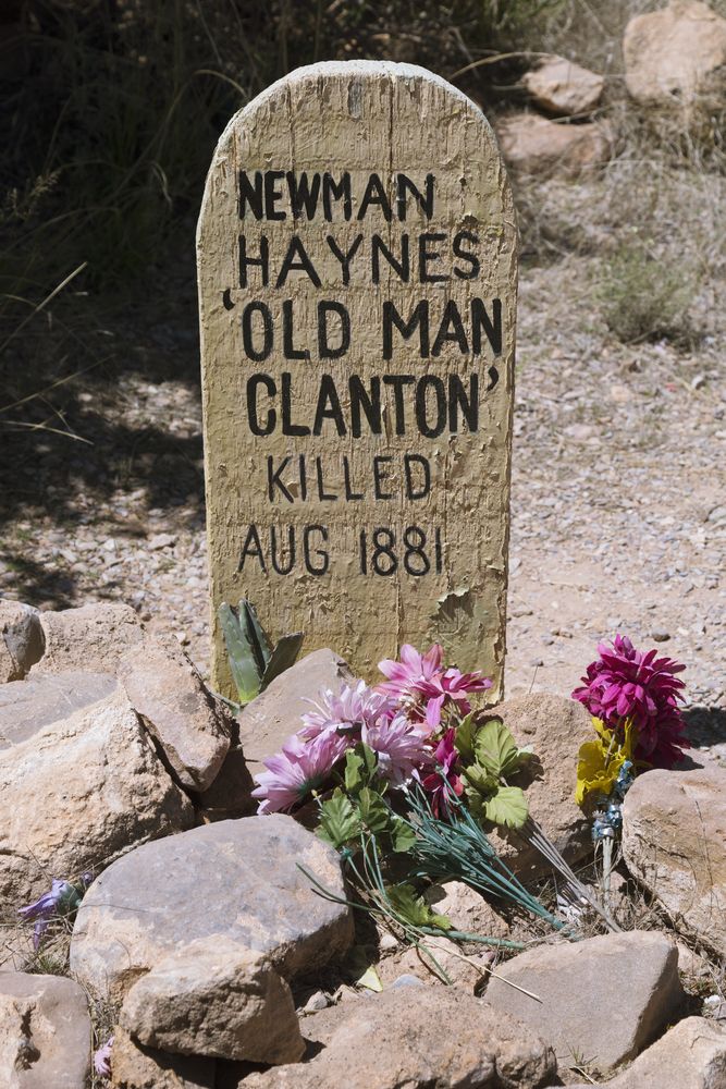 A tombstone with flowers at Boothill Cemetery
