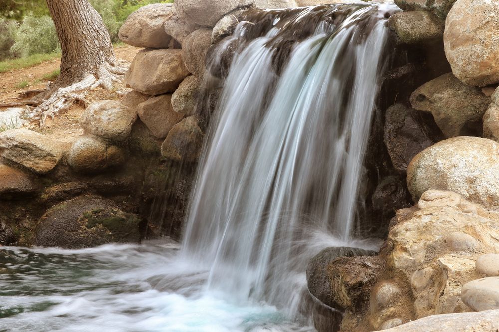A waterfall at Gene C. Reid Park