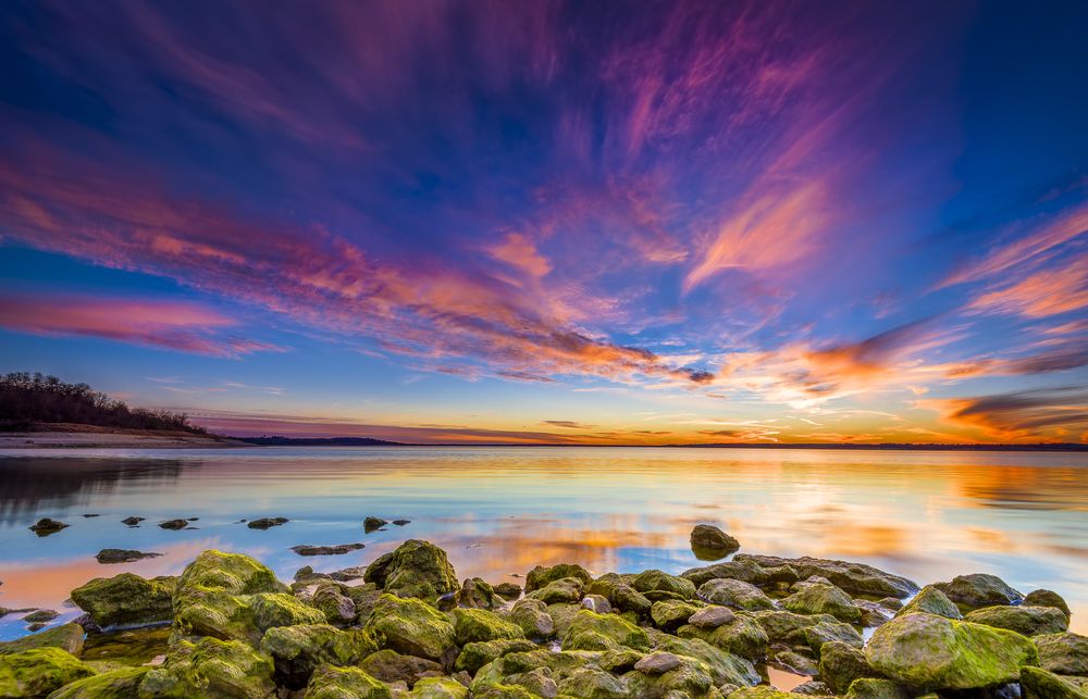 Colorful sunset reflecting on Benbrook Lake