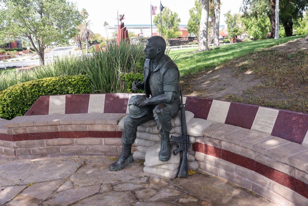 Soldier writing a letter sculpture at Temecula Duck Pond and Veterans Memorial Park