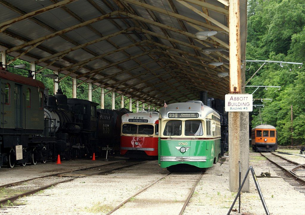 Old trains parked under a shed in national museum of transportation.