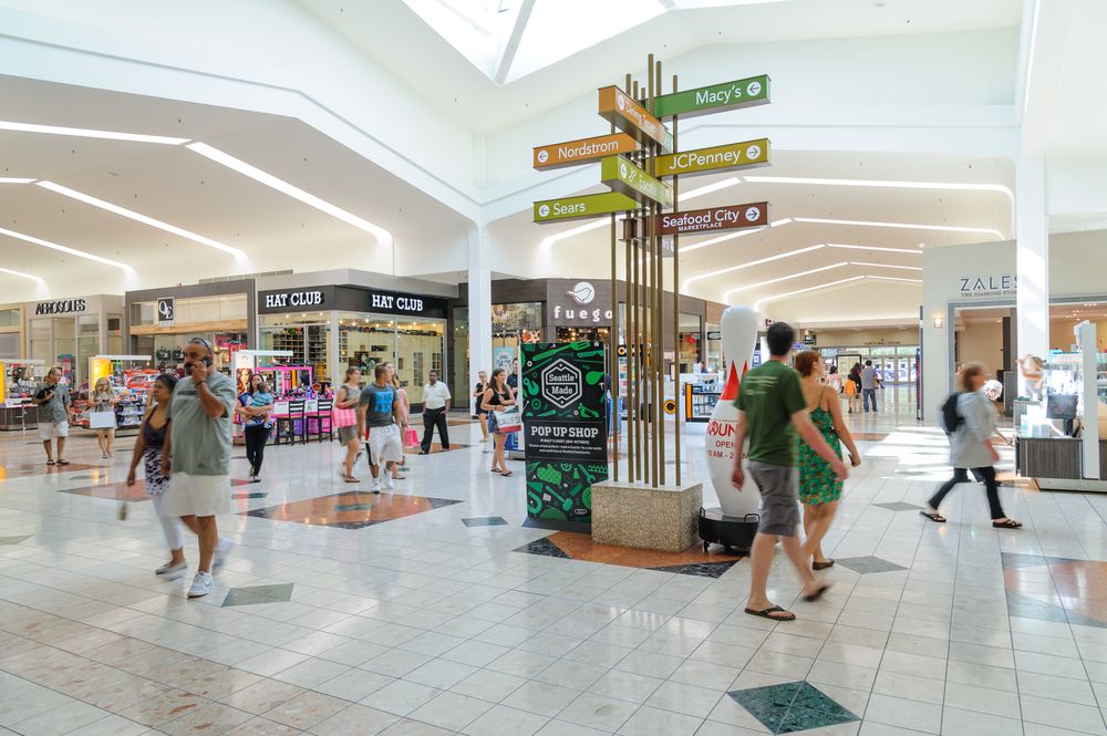 People walking around inside the Westfield Southcenter.