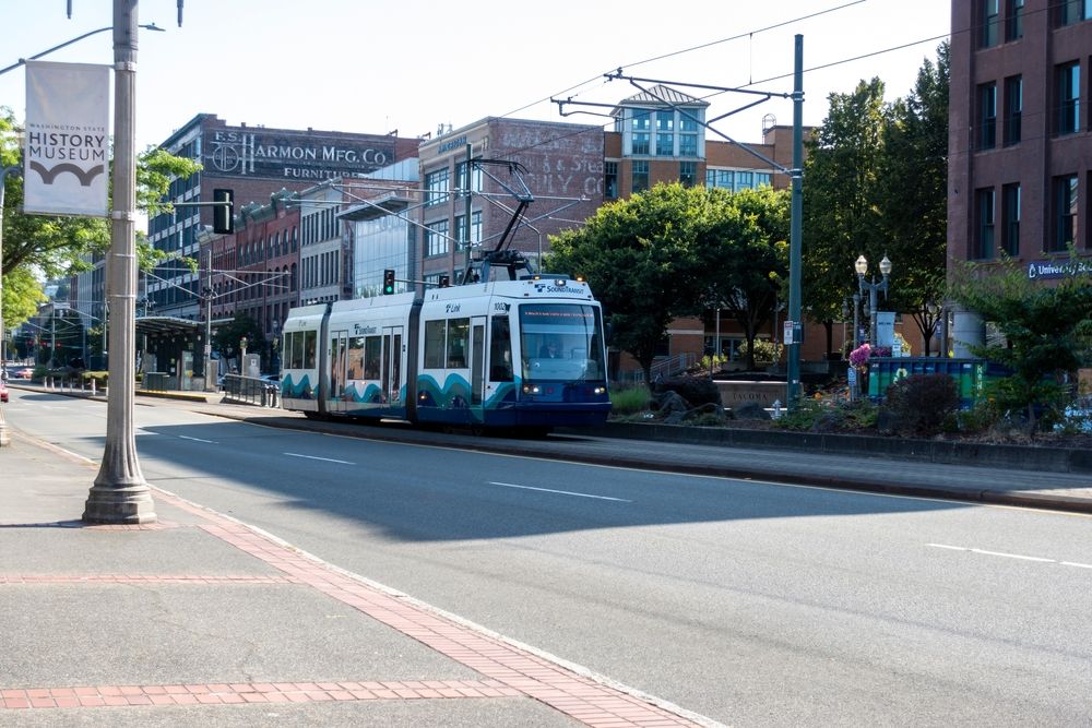 A Tacoma Link Light Rail along the road