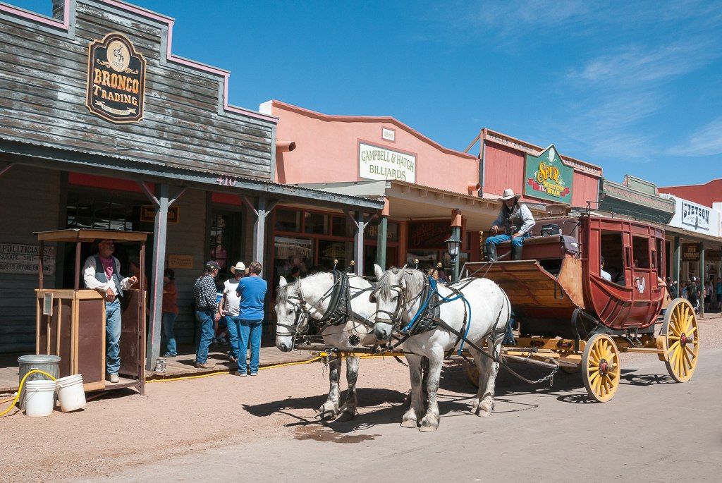 A horse carriage in front of East Allen Street shops