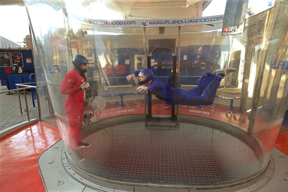 A person indoor skydiving in IFly