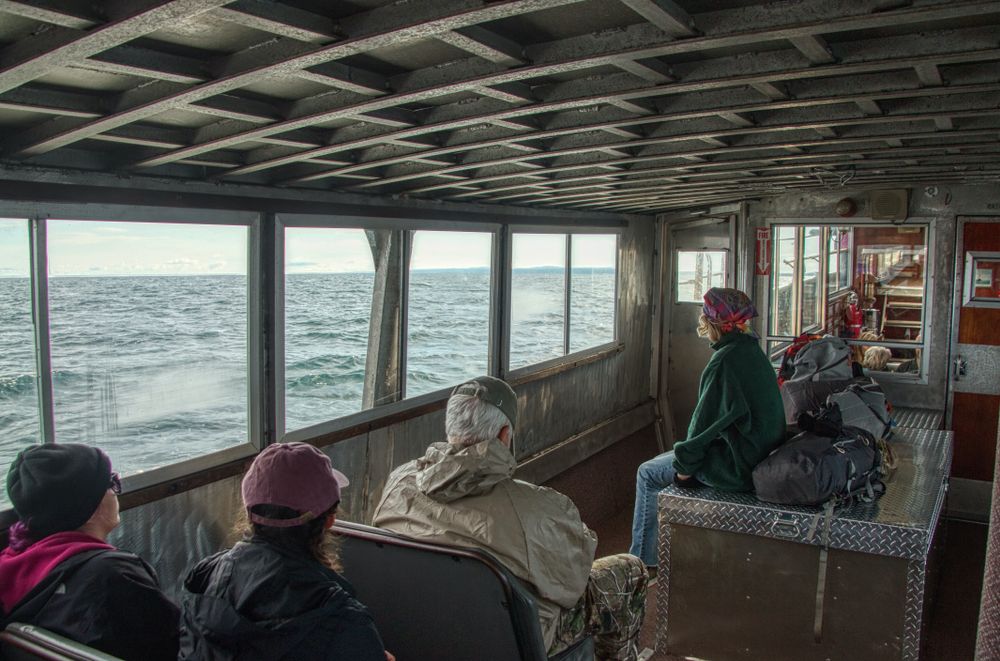 People riding a boat to Isle Royal National Park