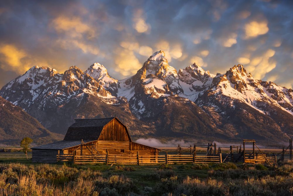 Mountains behind a barn at Grand Teton National Park.