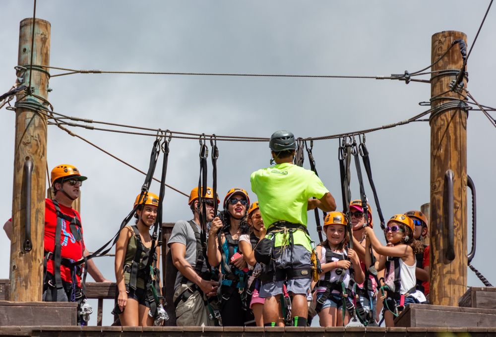 Tourist getting ready to hop on Flyin’ Hawaiian Zipline