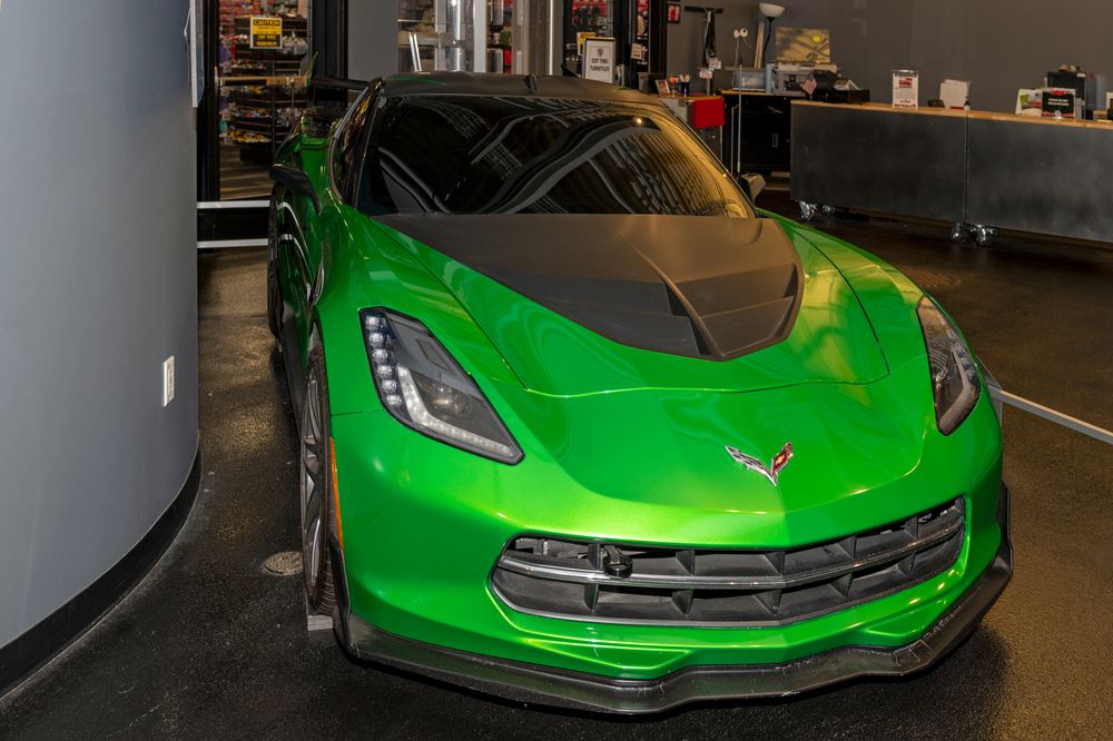 A green corvette in the National Corvette Museum