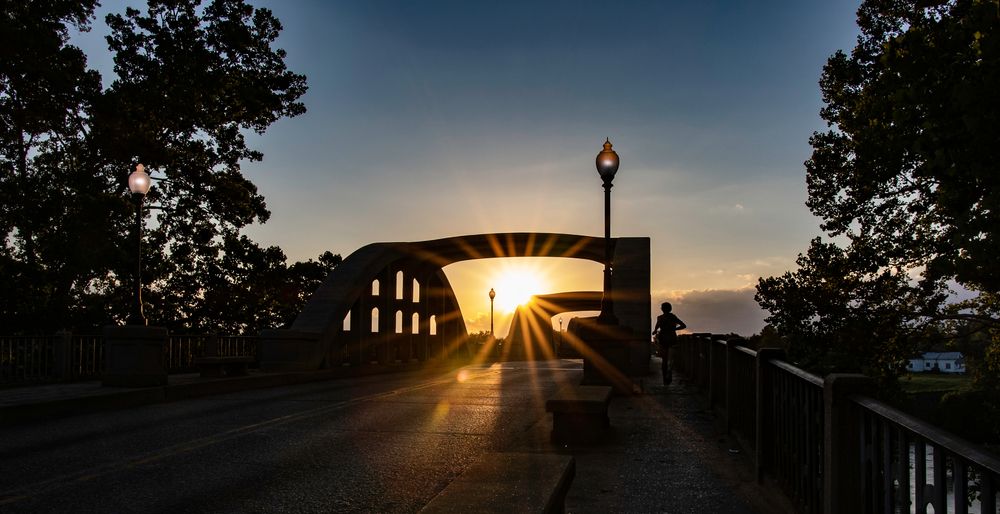 A person jogging on Bibb Graves Bridge