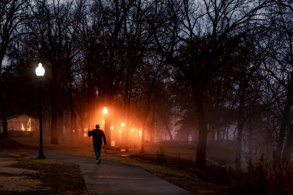 A man walking along Gold Star Park