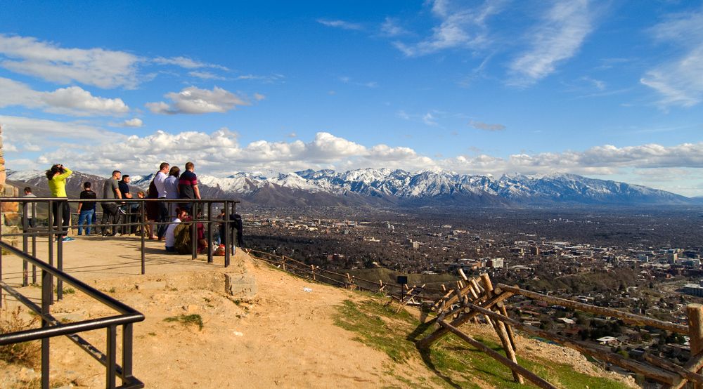 People admiring the views from Ensign Peak