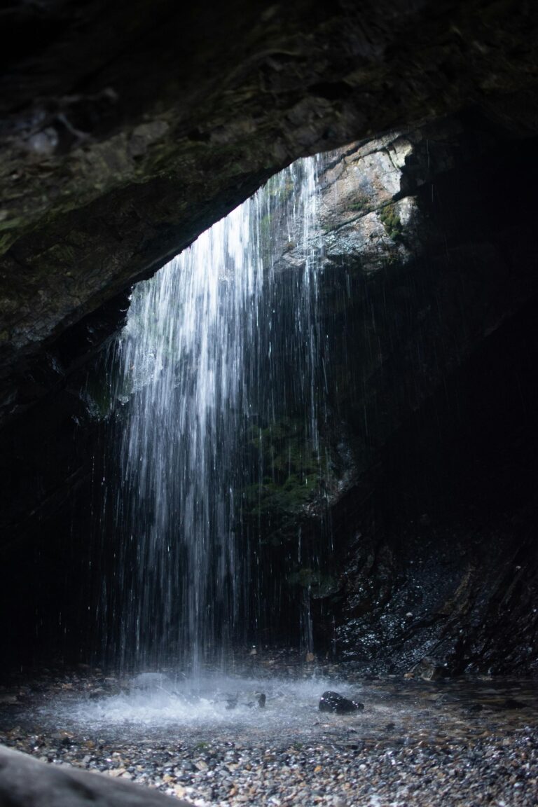 Doughnut Falls cascades through a natural cave opening, creating a serene hideaway in Utah’s Big Cottonwood Canyon.